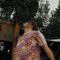 Av3rage looking upward in an outdoor portrait