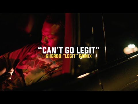 BloodGang Baby O seated inside a car under red light