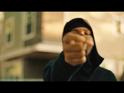 BloodGang Baby O rapping toward the camera on a Chicago block