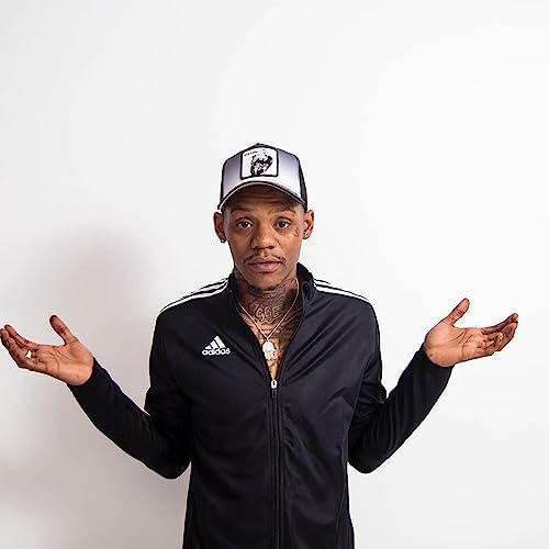 El Hitta posing in a black jacket and jewelry