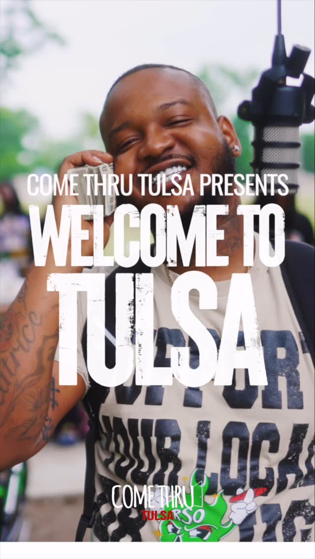 Mike Da Don rapping outdoors in a white shirt during a Come Thru Tulsa performance