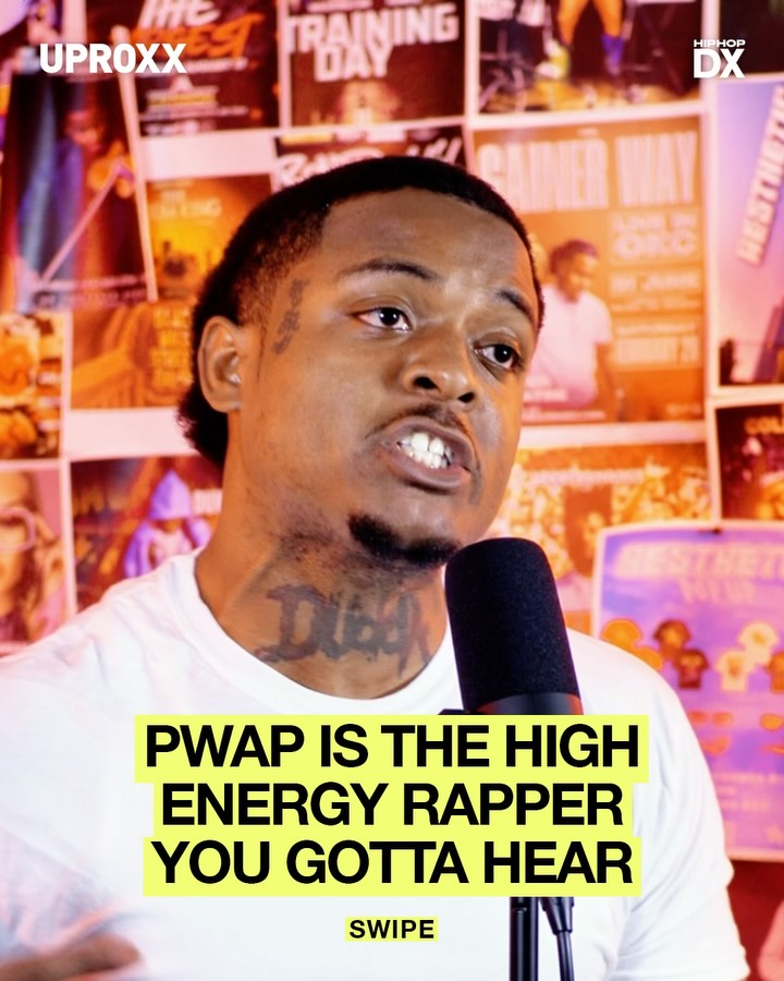 PWAP speaking into a microphone during an interview at a live event