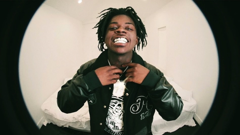 Austin rapper Quin NFN smiling toward a fisheye camera