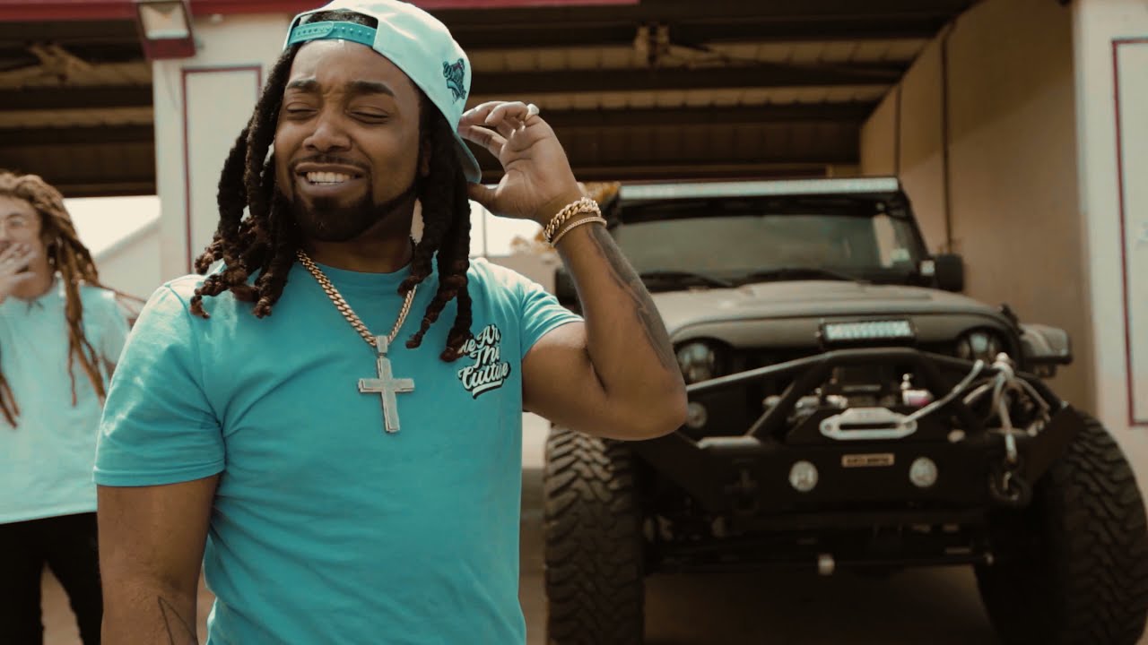 Rod Marley standing beside Kid Lennon during a music video
