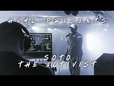 Soto The Activist performing into a microphone in a recording studio