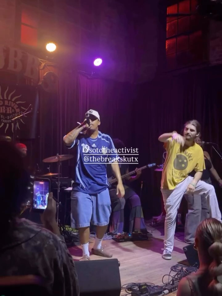 Soto The Activist performing with a live band at an Austin venue