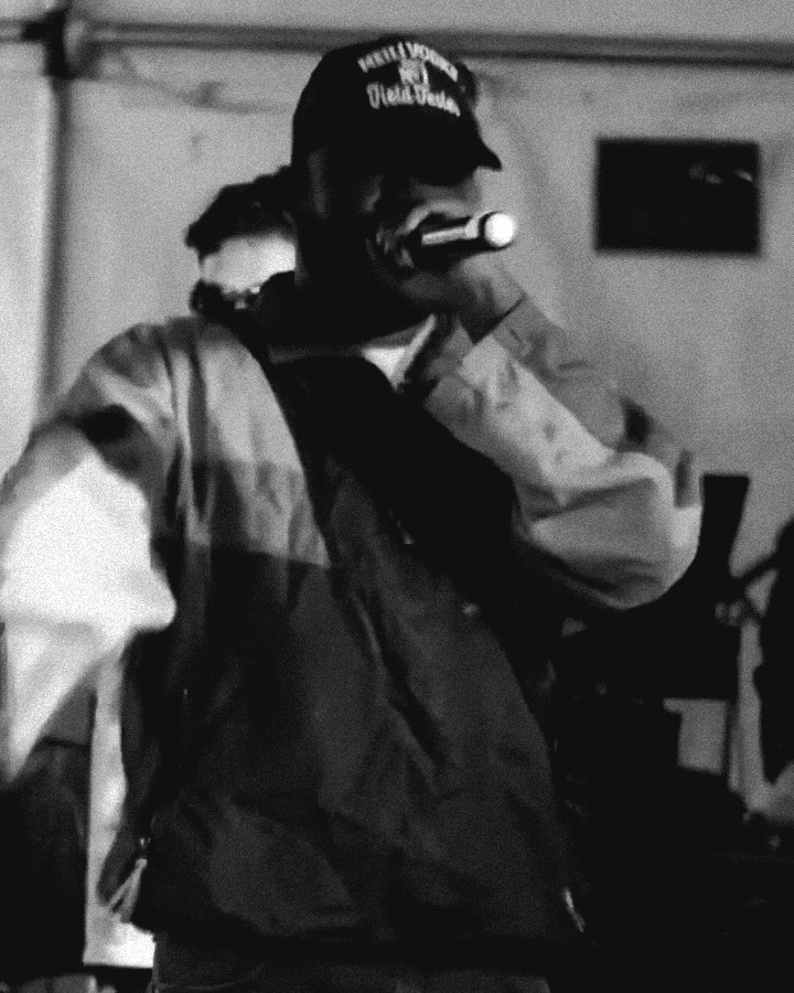 SouthSide Hippie performing onstage in a baseball cap
