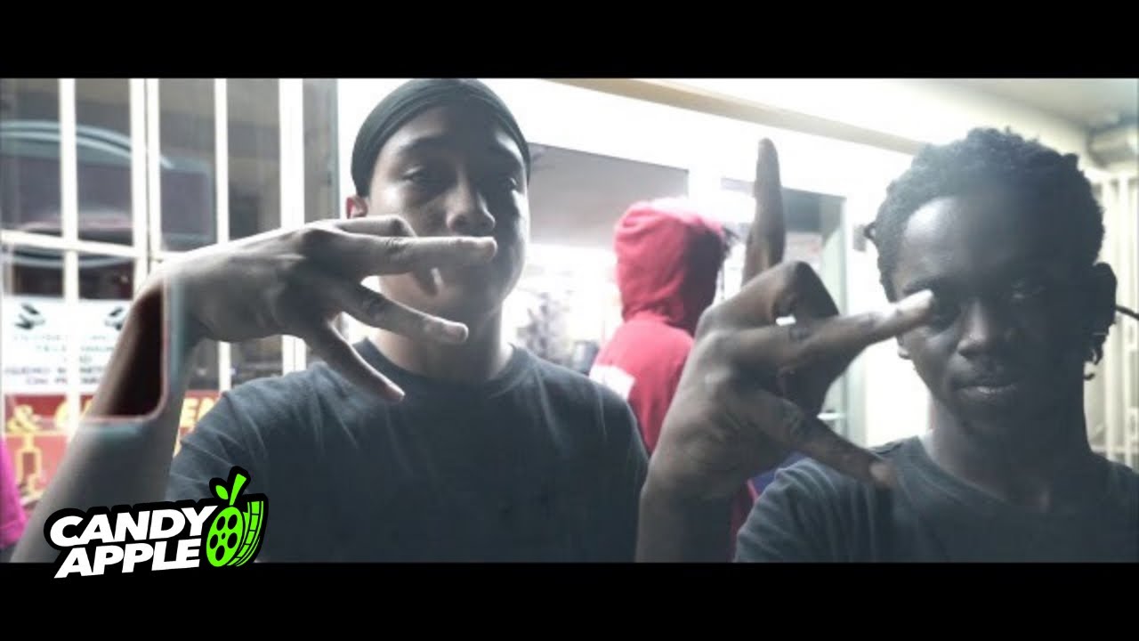 Wiardon and Monte Nissa seated together in a music video